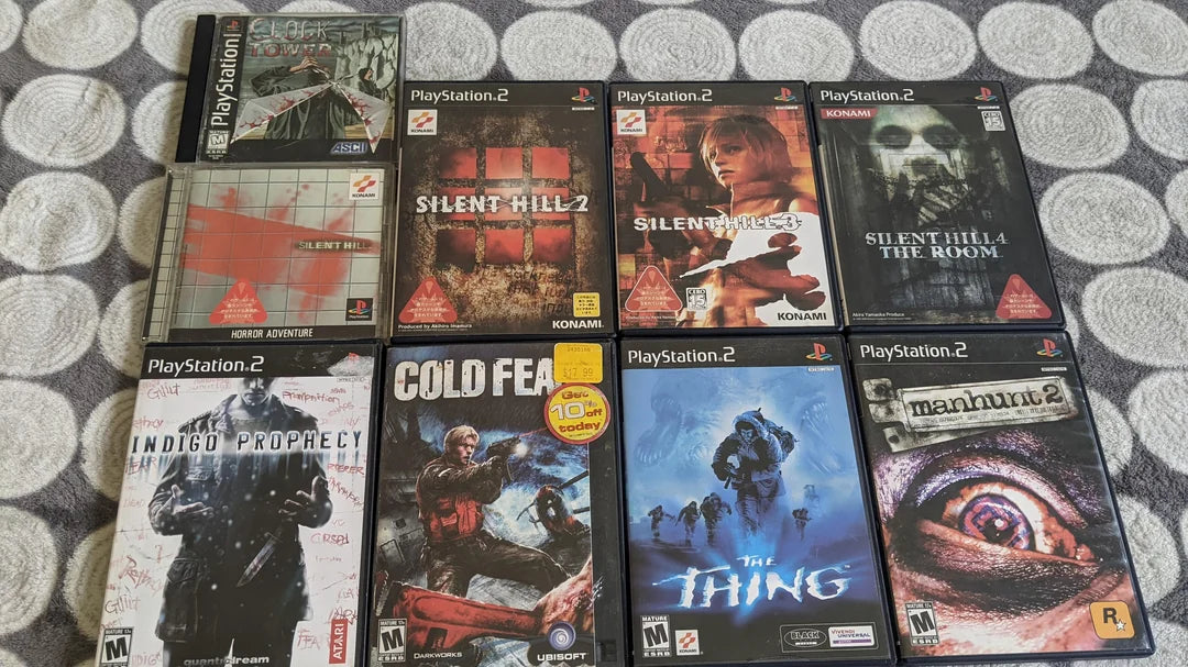 Collection of classic retro horror video games including Resident Evil, Silent Hill, Clock Tower, Fatal Frame, and other survival horror titles for collectors.