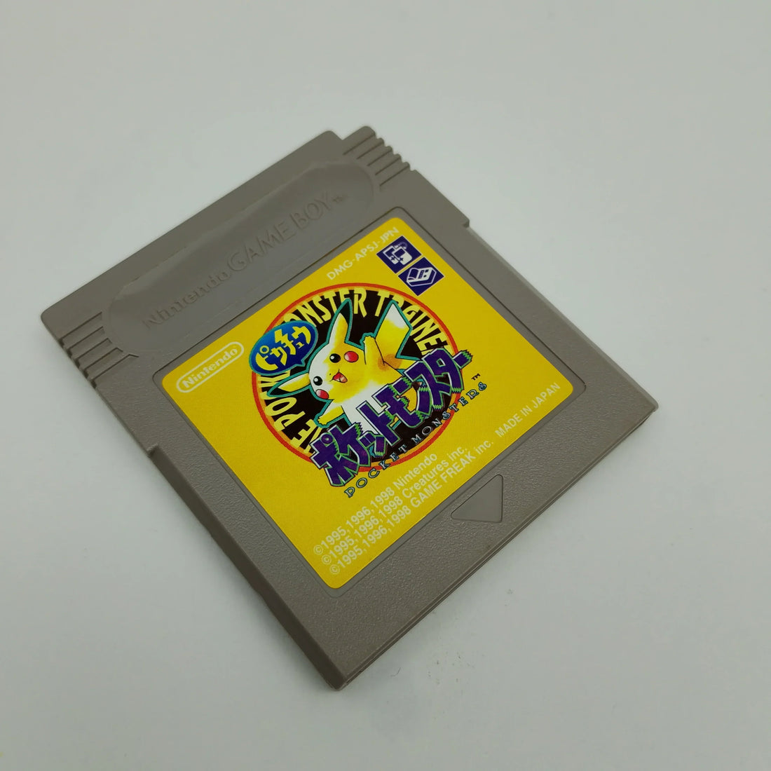 Original Nintendo Game Boy consoles and classic Pokémon cartridges displayed together for retro gaming collectors in 2026.