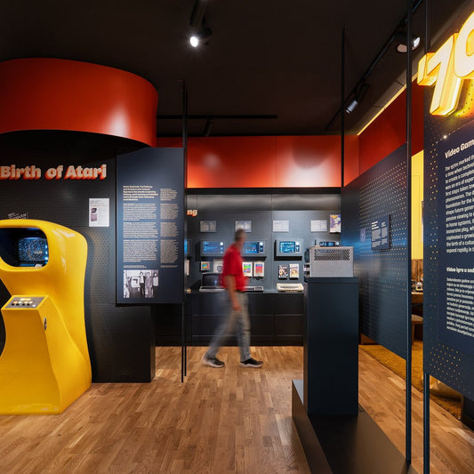 Museum-quality retro game collection featuring authentic consoles, Complete-in-Box games, original accessories, and professionally displayed gaming memorabilia.