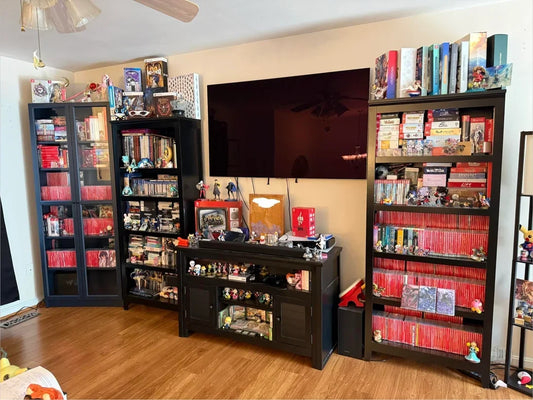 Well-organized retro game collection featuring classic consoles, cartridges, discs, and Complete-in-Box games stored safely for long-term preservation.