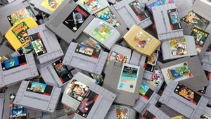 Retro gaming collection featuring classic PlayStation, Nintendo, SEGA, and Game Boy games and consoles arranged for beginner collectors.