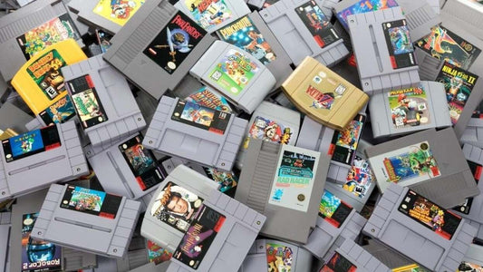 Retro gaming collection featuring classic PlayStation, Nintendo, SEGA, and Game Boy games and consoles arranged for beginner collectors.