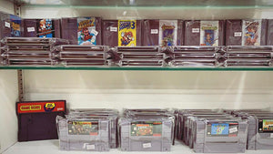Pre-owned gaming consoles display
