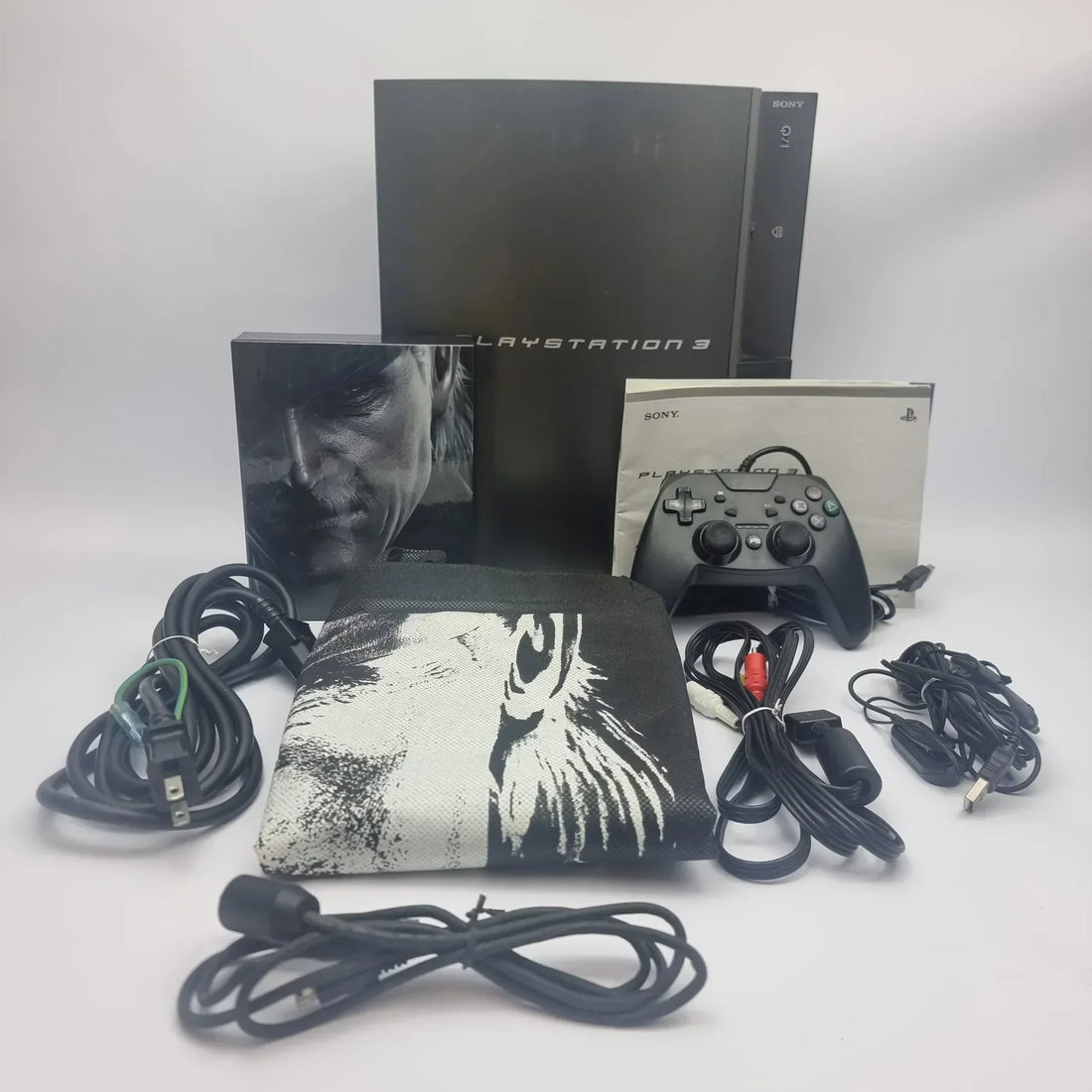 Complete box set of the PS3 Metal Gear Solid 4 Premium Pack with console, controller, and packaging