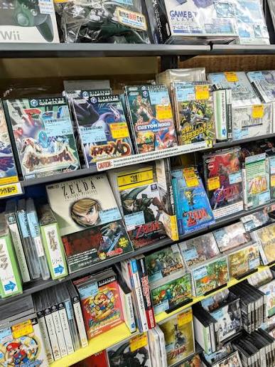 Collection of rare Japanese exclusive retro games for Nintendo, PlayStation, SEGA, Neo Geo, and PC Engine displayed for collectors.