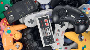 Collection of retro gaming controllers Nintendo PlayStation Sega