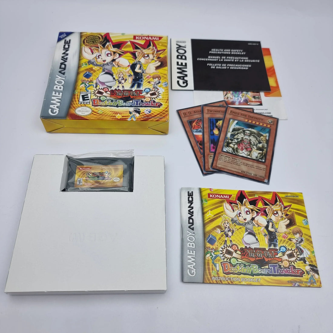 Original retro video game manuals, maps, registration cards and inserts displayed alongside Complete-in-Box games for collectors.