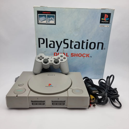 Retro gaming collection in the UAE featuring classic PlayStation, Nintendo and SEGA consoles with original physical games.