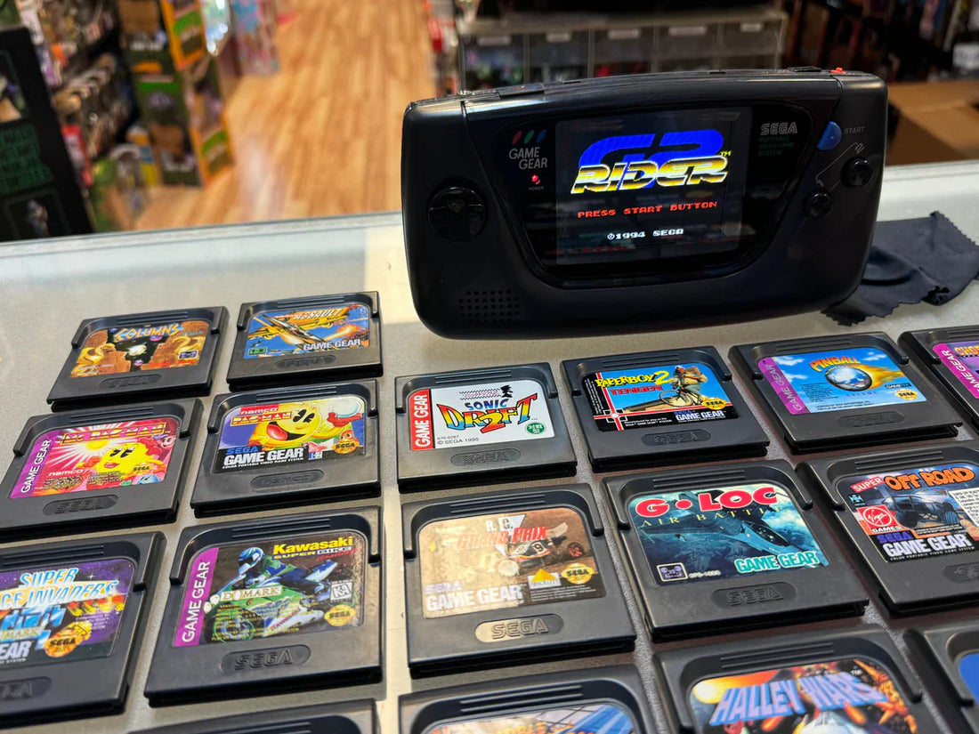 Collection of retro Sega Game Gear handheld consoles and physical cartridges in the UAE