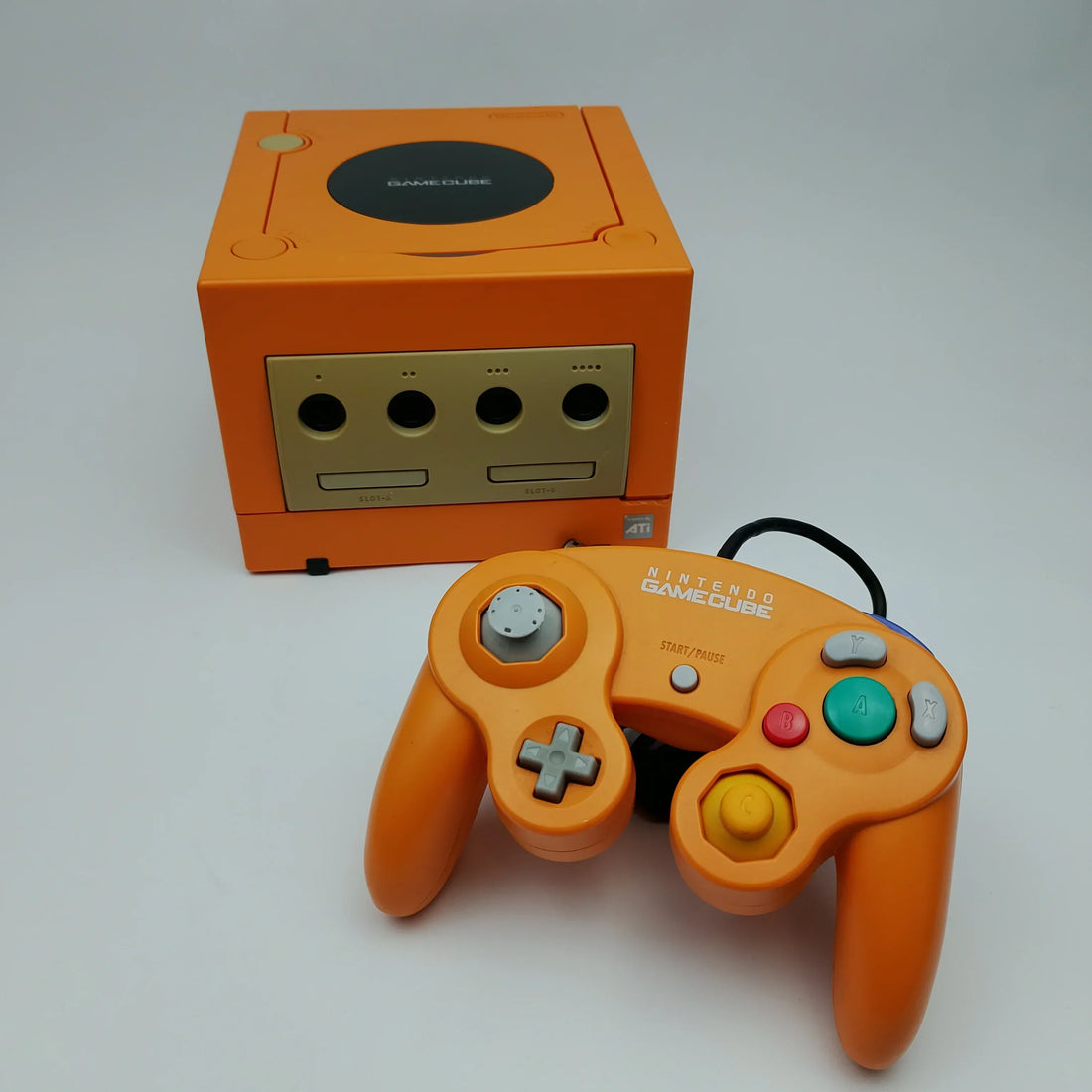 Collection of authentic Japanese retro game consoles including Nintendo Famicom, Super Famicom, PlayStation, Sega Saturn, Dreamcast, and PC Engine displayed for collectors.